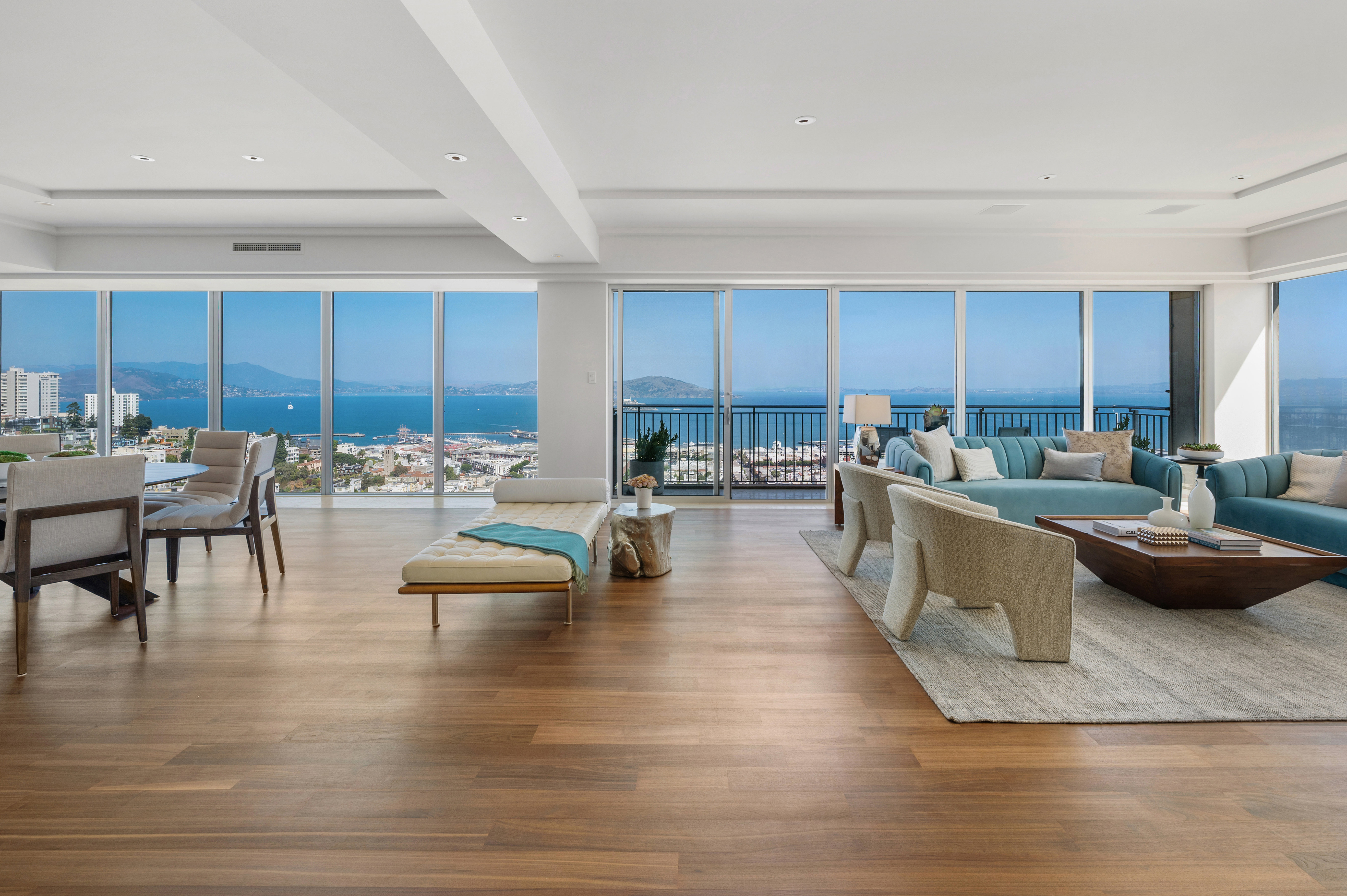 Floor to ceiling panoramic North Bay and water views from modern living and dining areas.