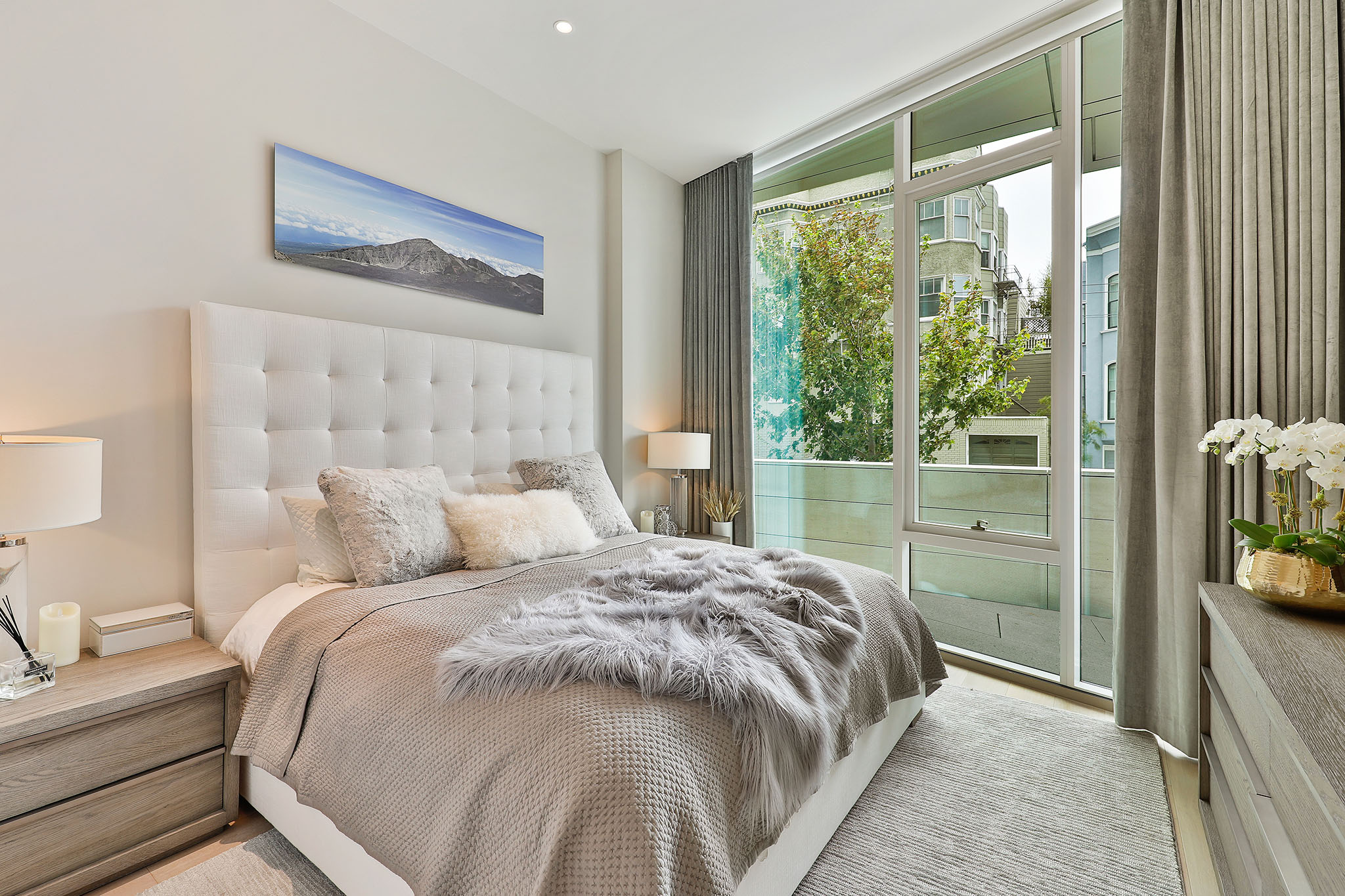 Bedroom with floor to ceiling windows to terrace