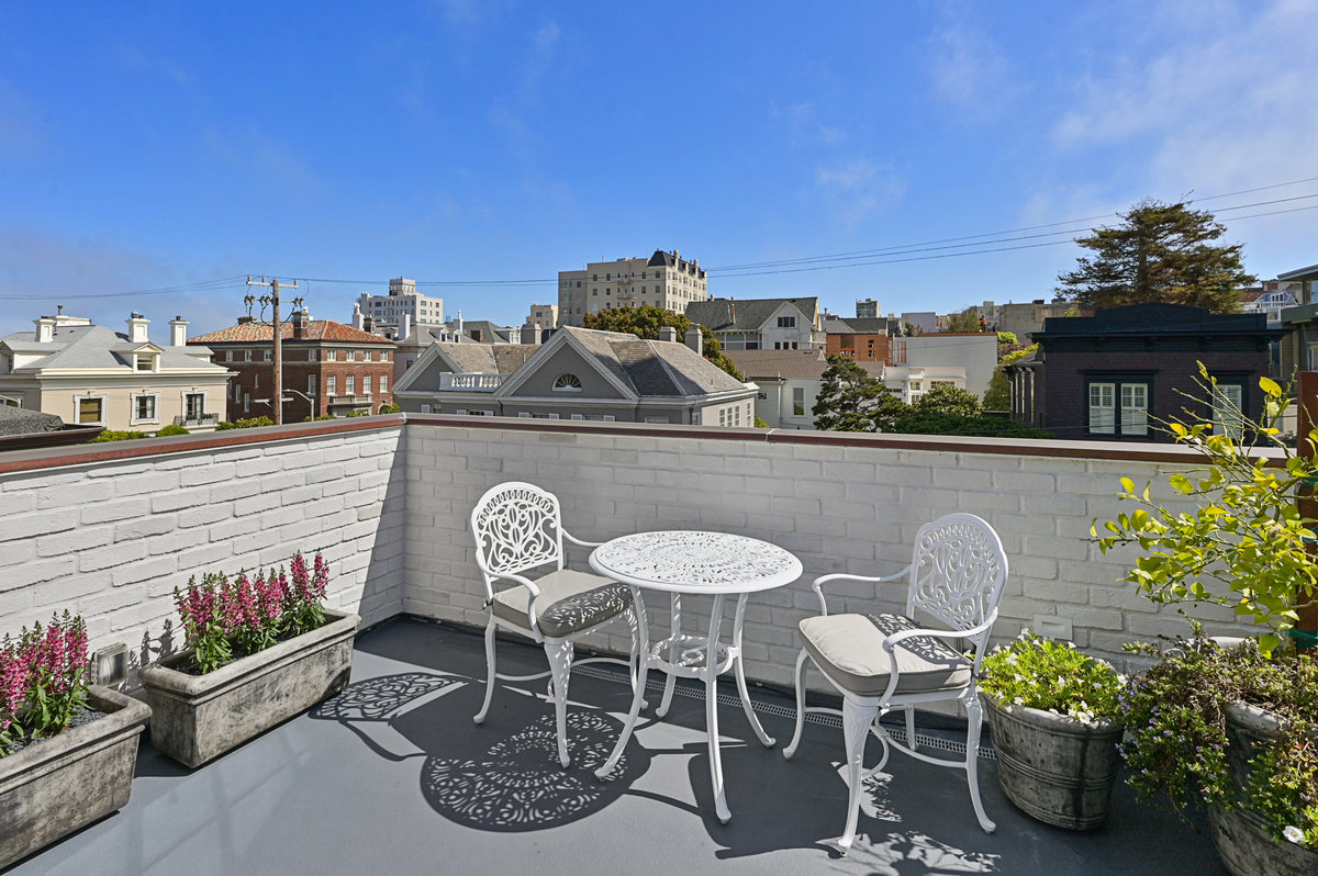 Upper level east terrace with partial bay views