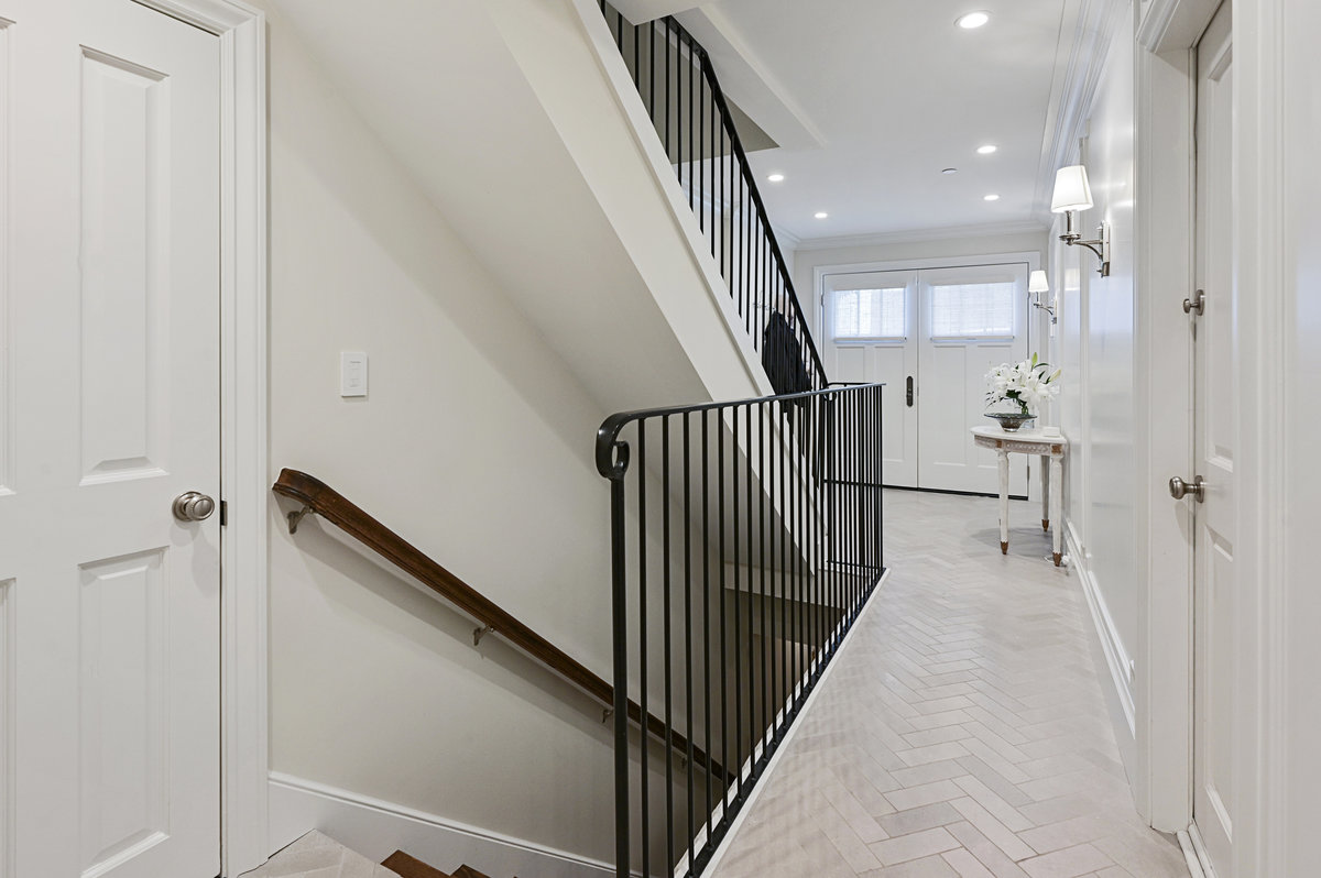 Stairs to lower level wine/media room