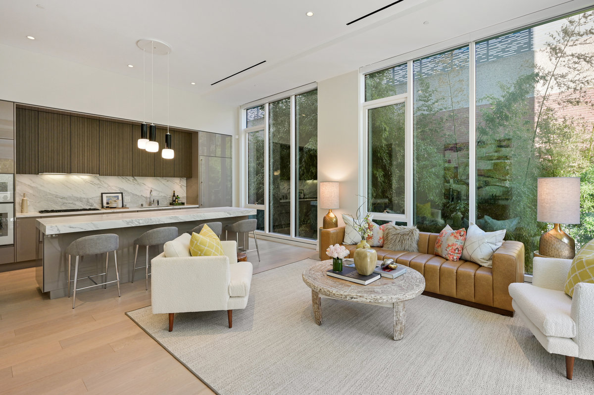 Great room & kitchen with north windows facing wall of bamboo