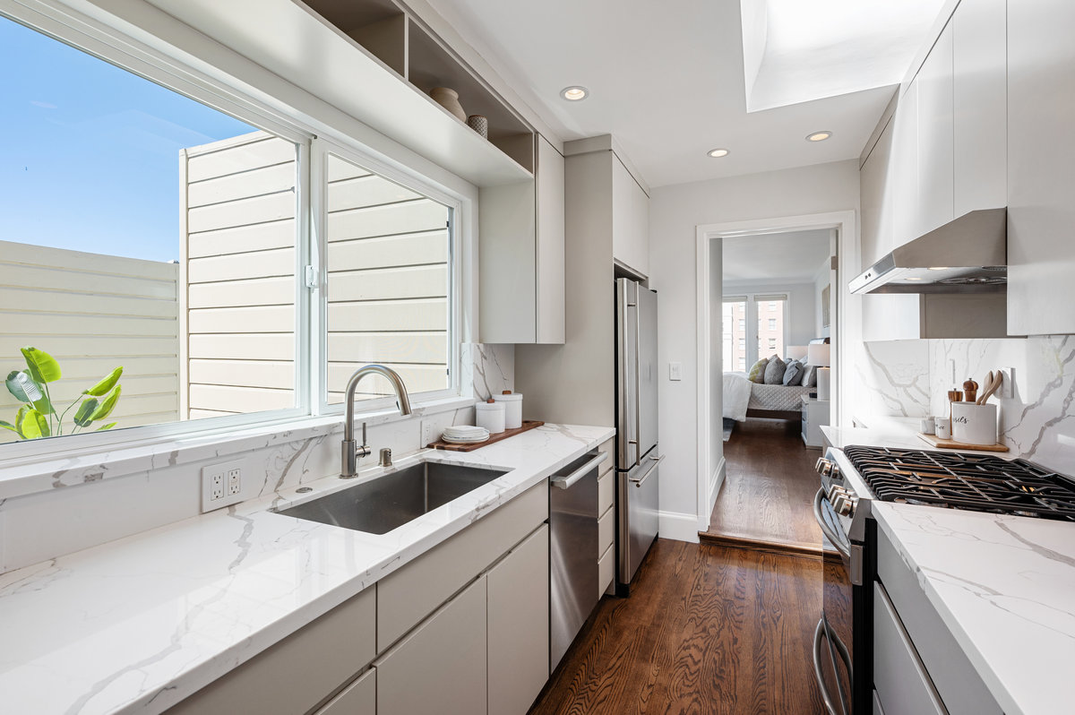 Kitchen with large west window and skylight