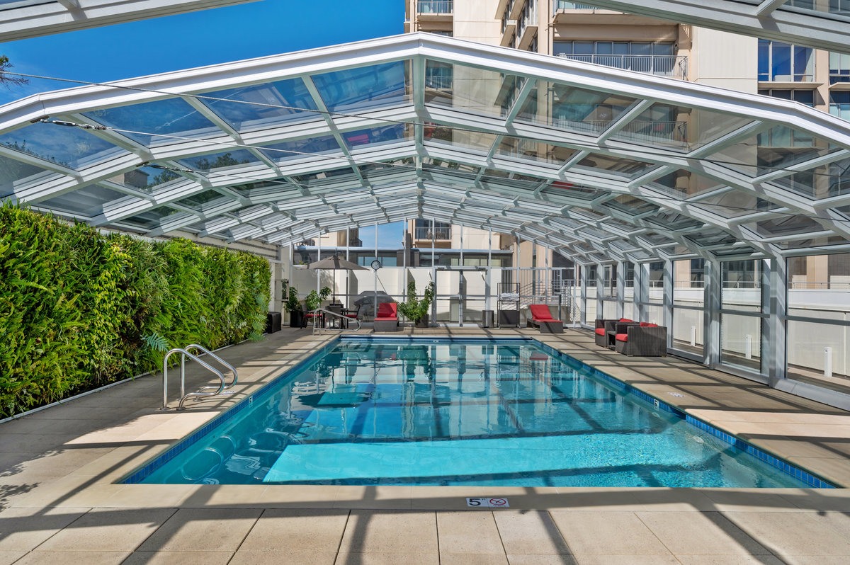 Heated pool with operable roof opening