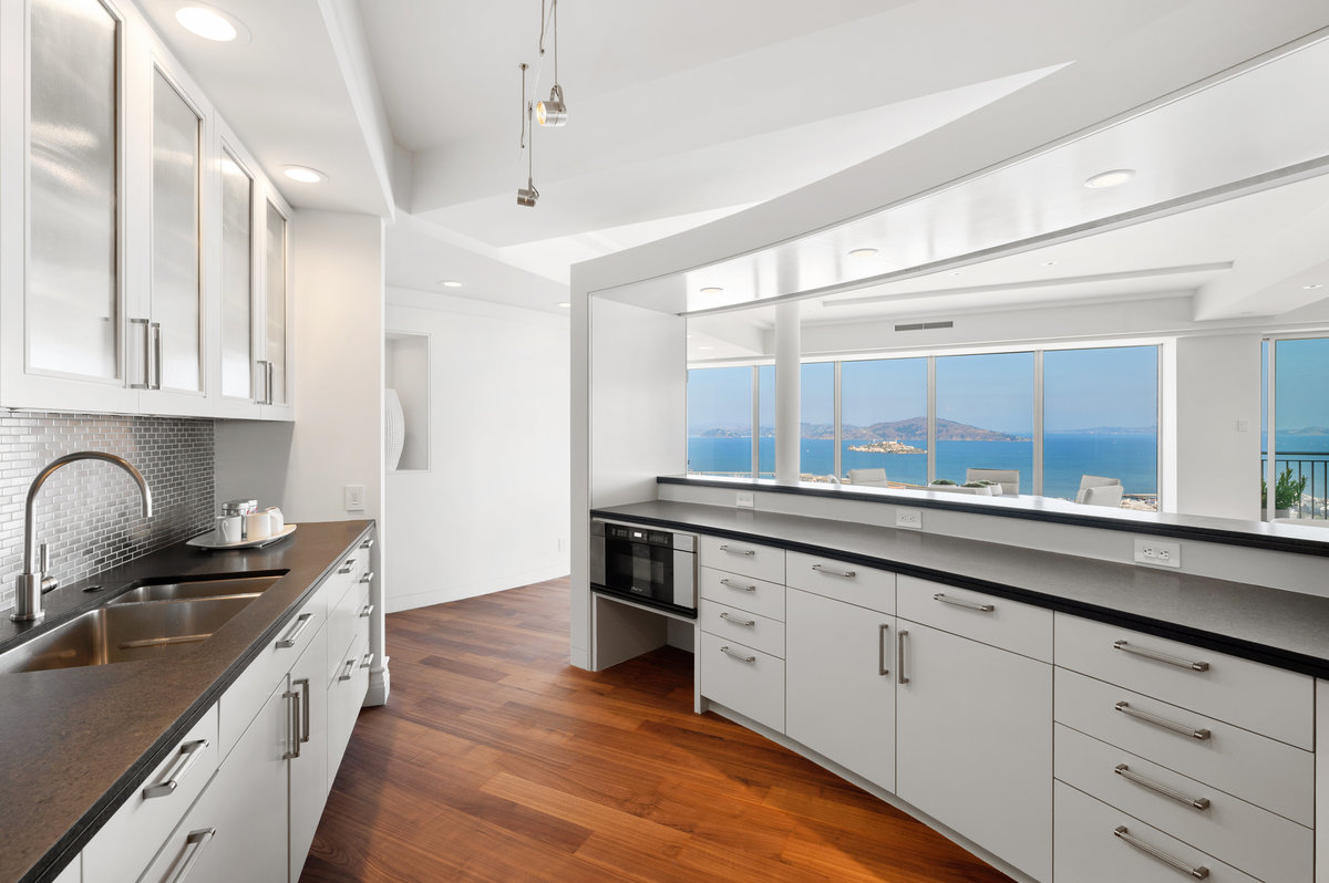 Even the kitchen offers water and impressive views to accompany the beautiful finishes