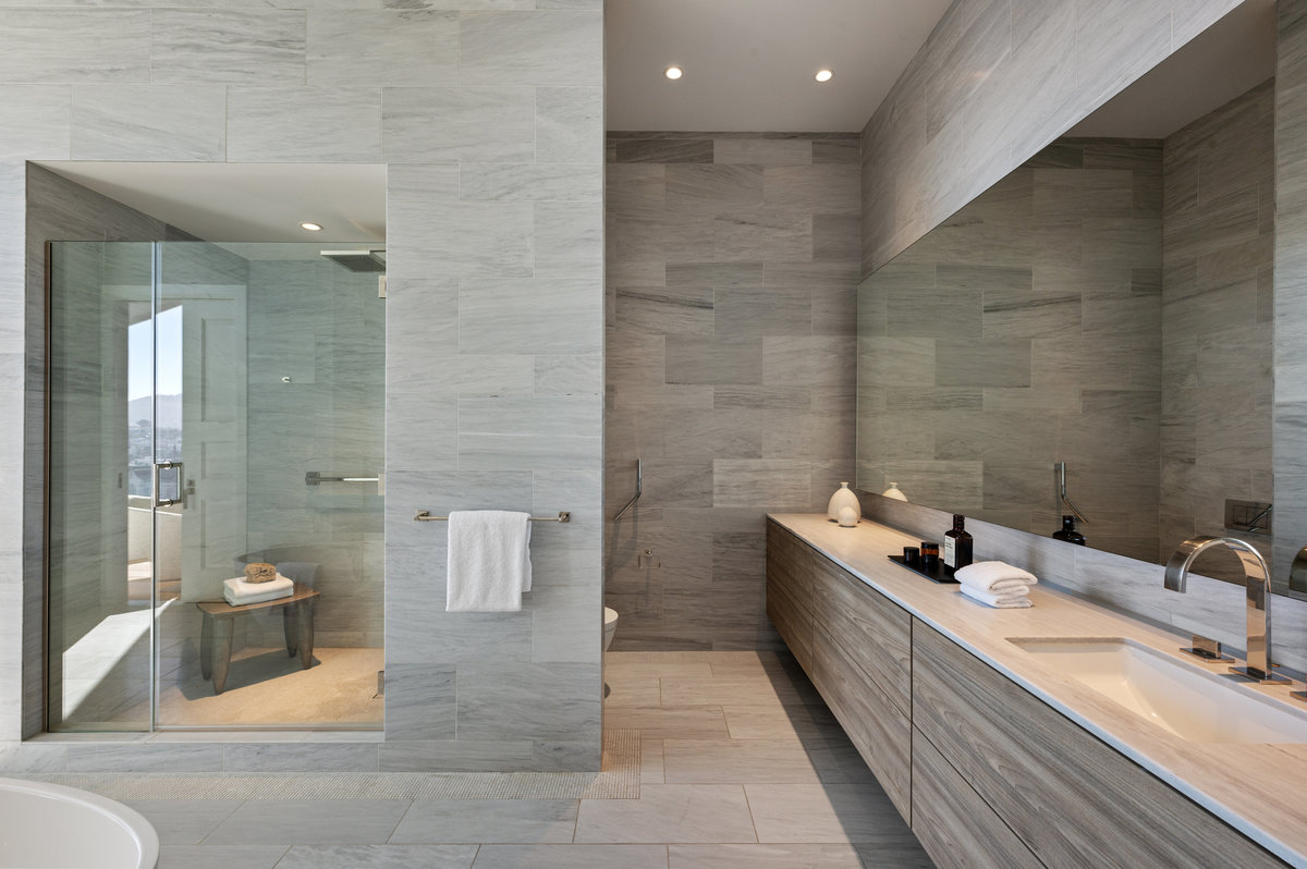 Primary suite offers 2 vanities, 2 Toto's  flanking the shower and soaking tub