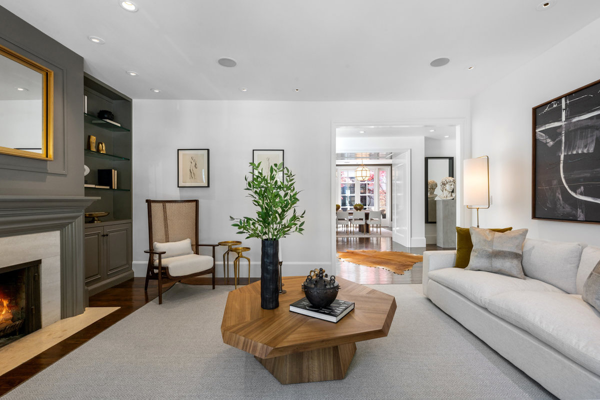 Living room to foyer to dining with center patio in background