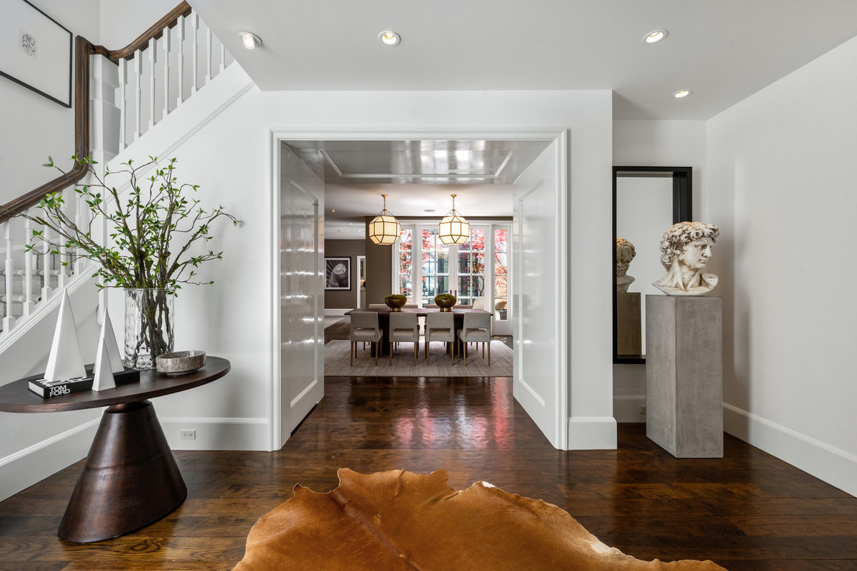 Entry foyer to dining room; exquisite hand-planed wood floors throughout this home