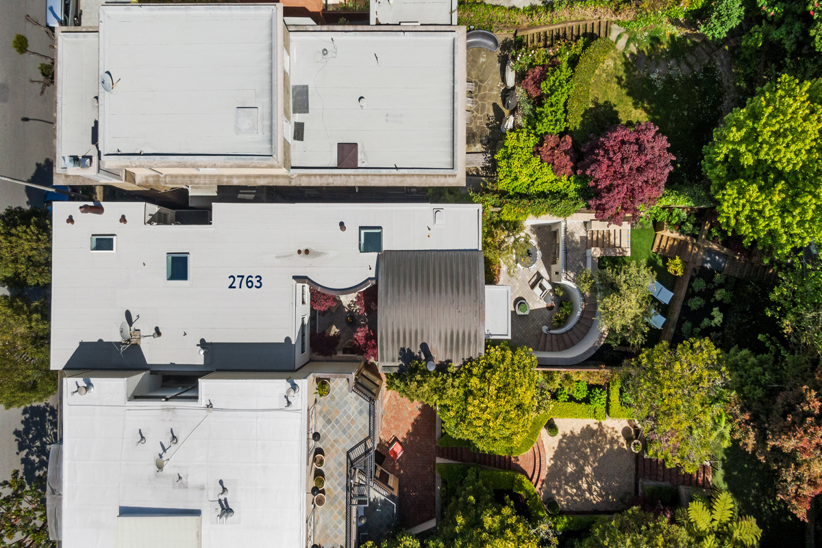 Aerial image of 2763 and its gardens and curved staircase on the right