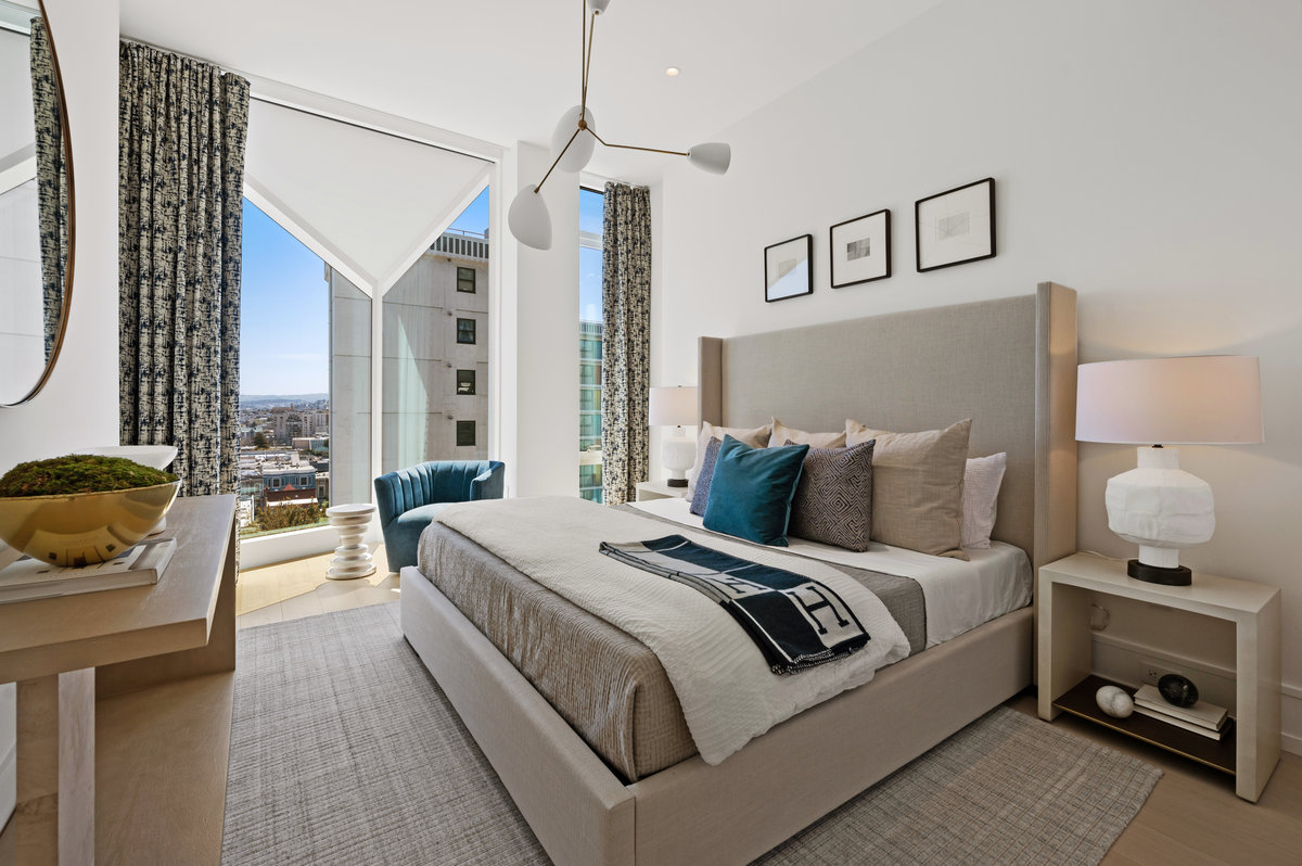 Primary suite with aperture window, modern architecture's nod to a bay window, that allows for views far to the east and west on Sacramento. Loung