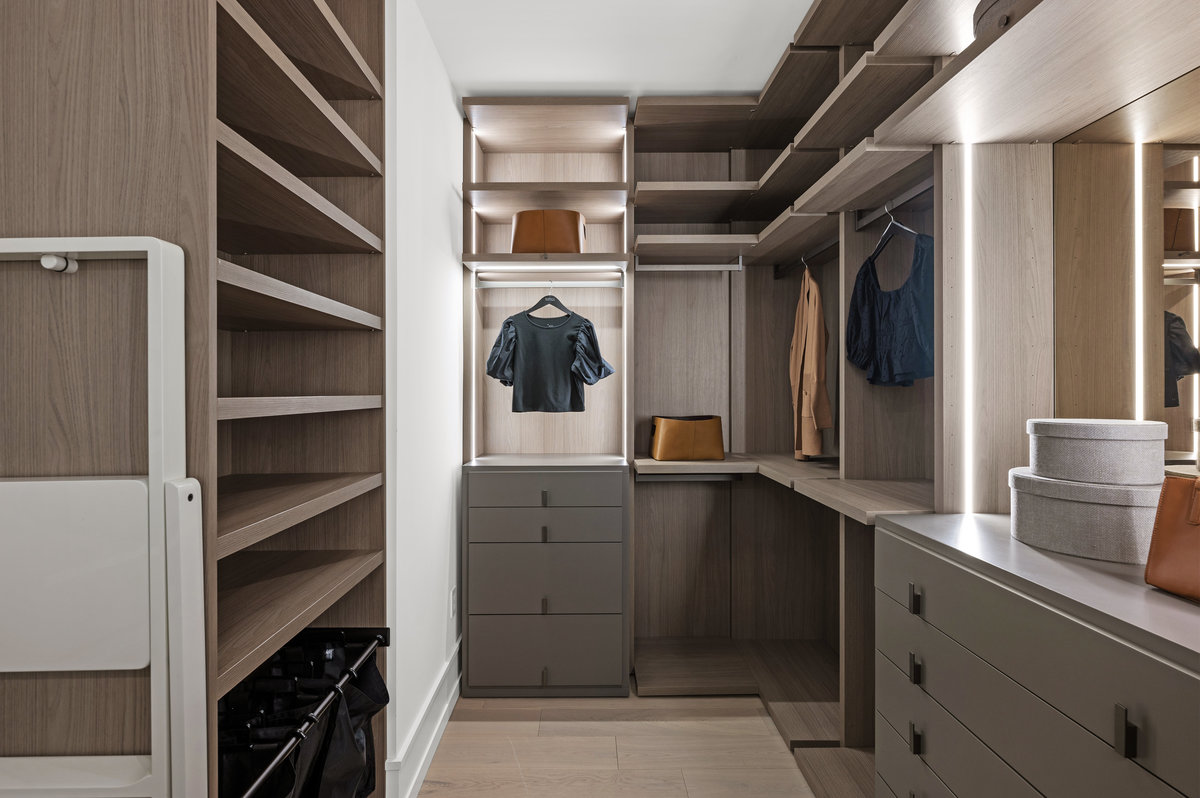 Image 1 of 2 of the primary suite's large custom closet
