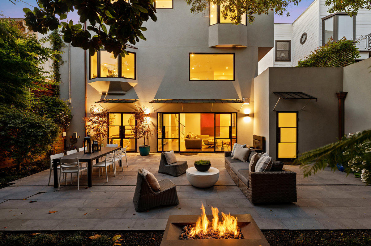 South patio & garden at twilight; fire pit in foreground