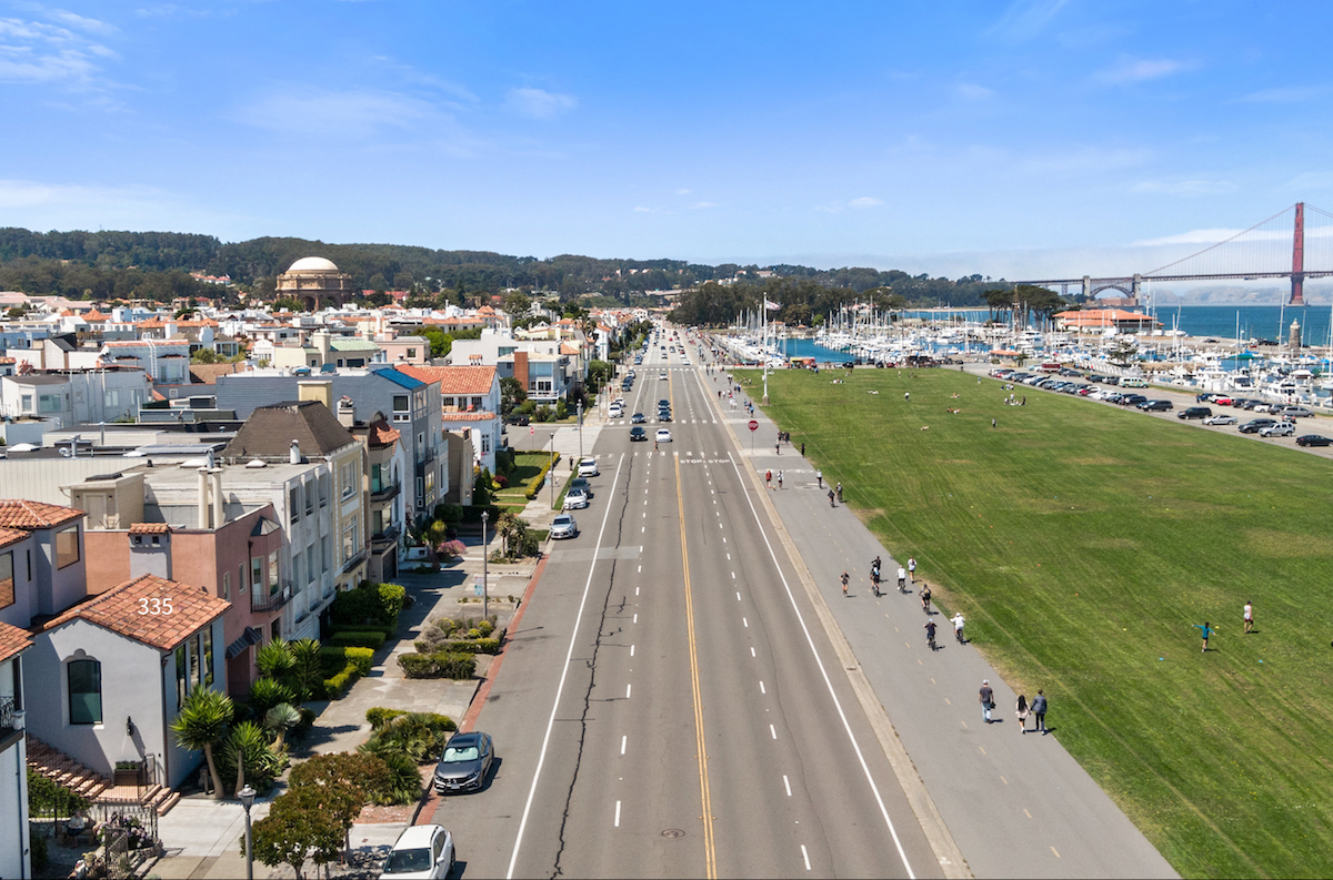 Aerial view to the west on Marina Blvd featuring the Palace of Fine Arts with the Presidio beyond it and the Golden Gate Bridge