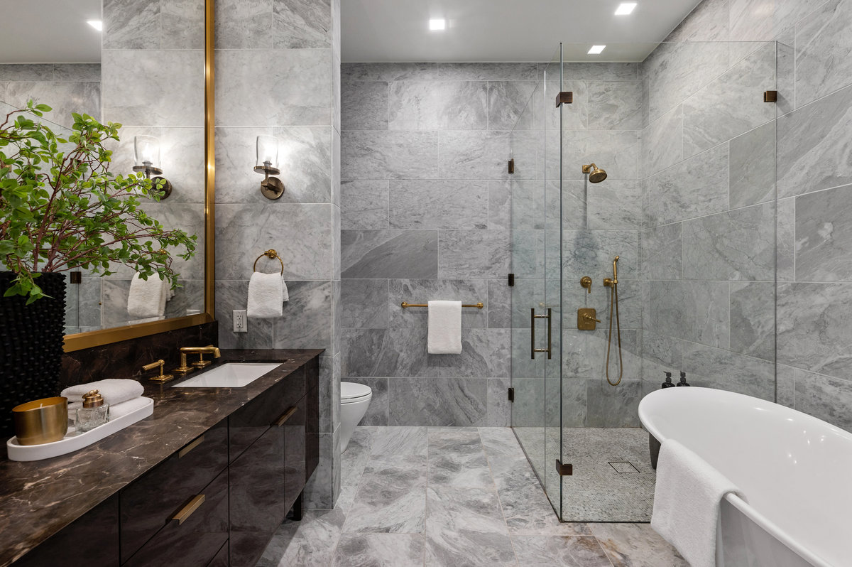Primary bath, marble & brass finishes, dual sinks, shower, soaking tub