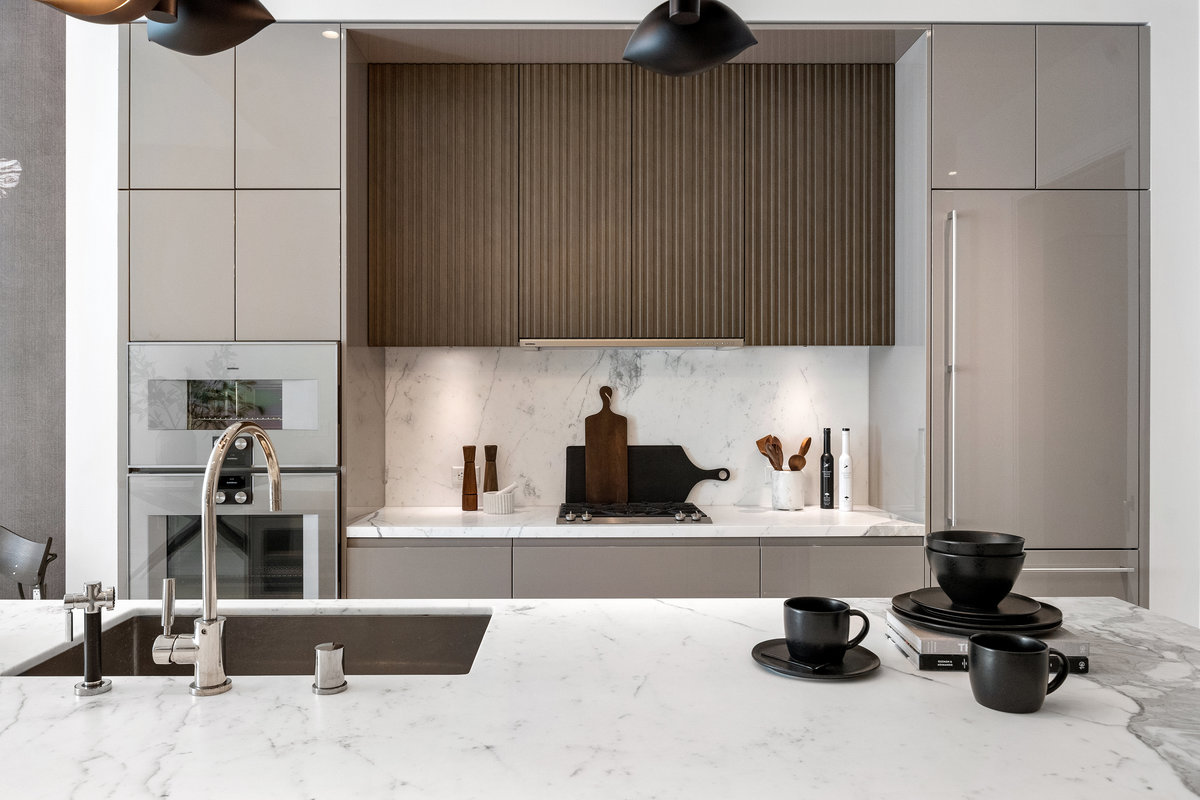 European kitchen with statuario marble counters, ArcLinea cabinetry & Gaggenau appliances
