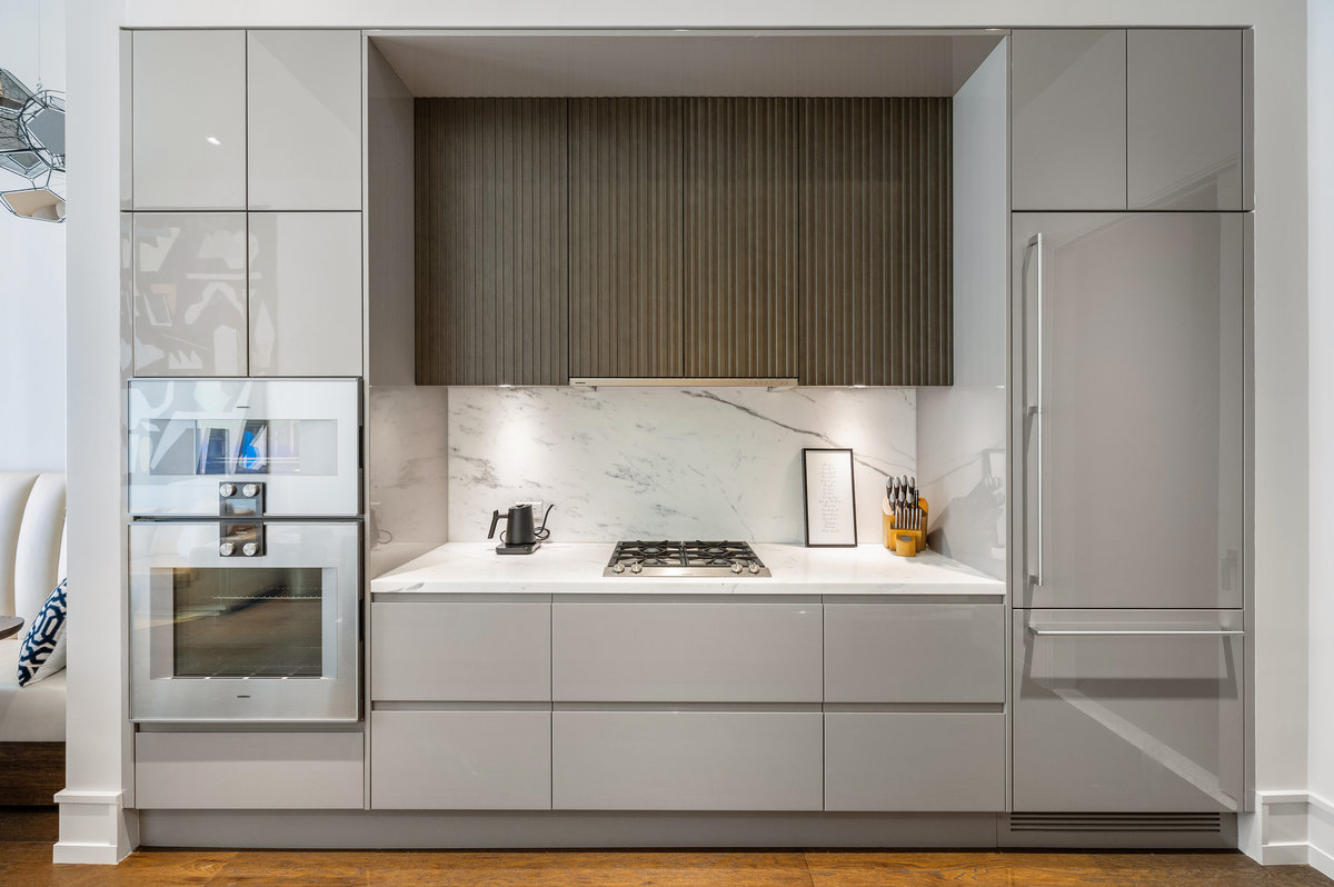 Arclinea cabinetry & Gaggenau appliances with statuario marble counters