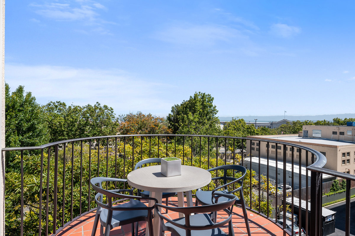 The living room’s lovely curved terrace faces northeast