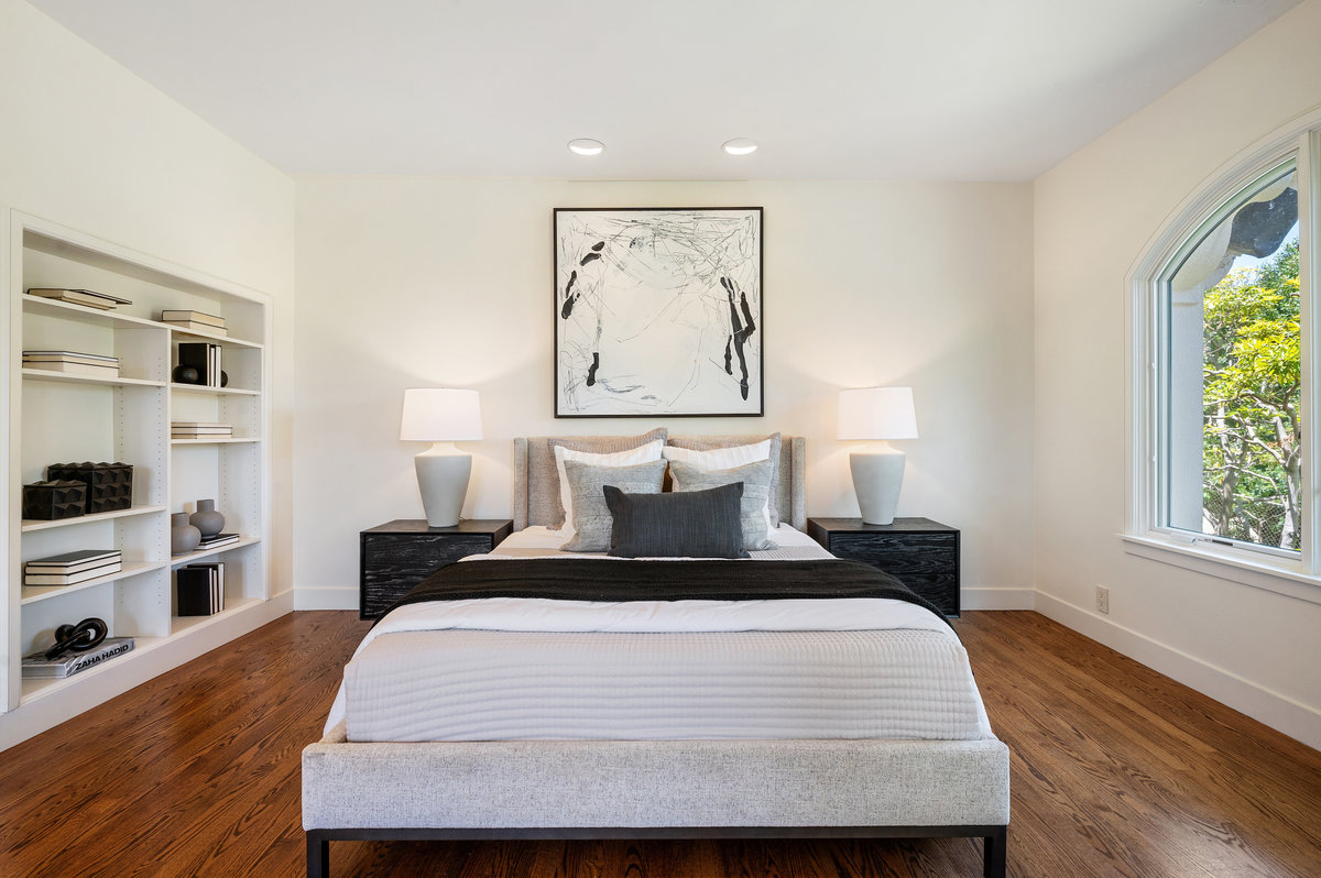 Bedroom 2 with built-in bookshelves