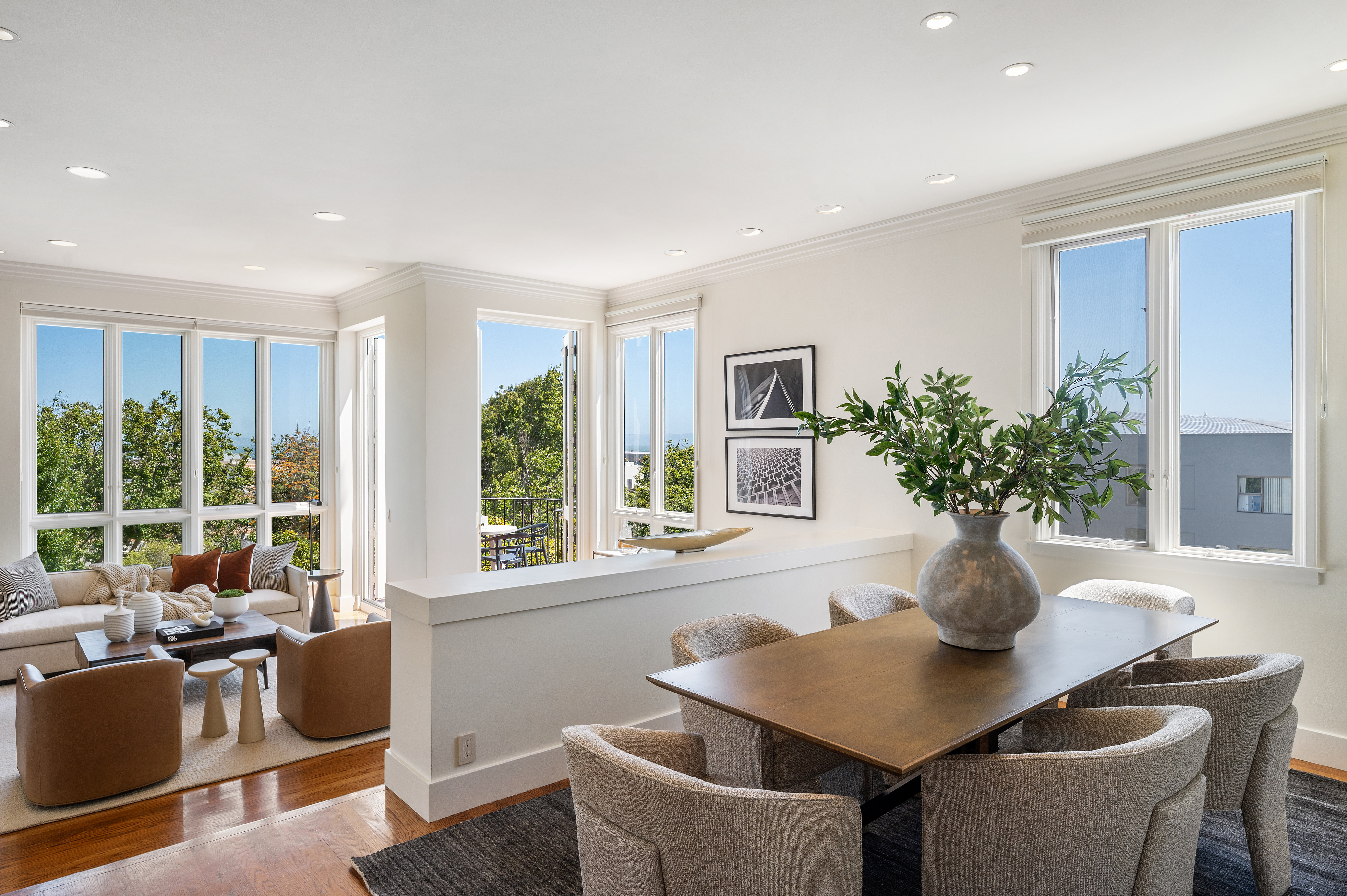 Elegant sunken living room with open dining room