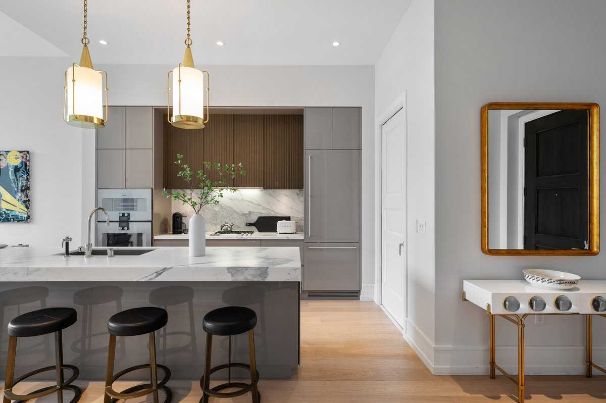 Counter seating in kitchen, entry area to right