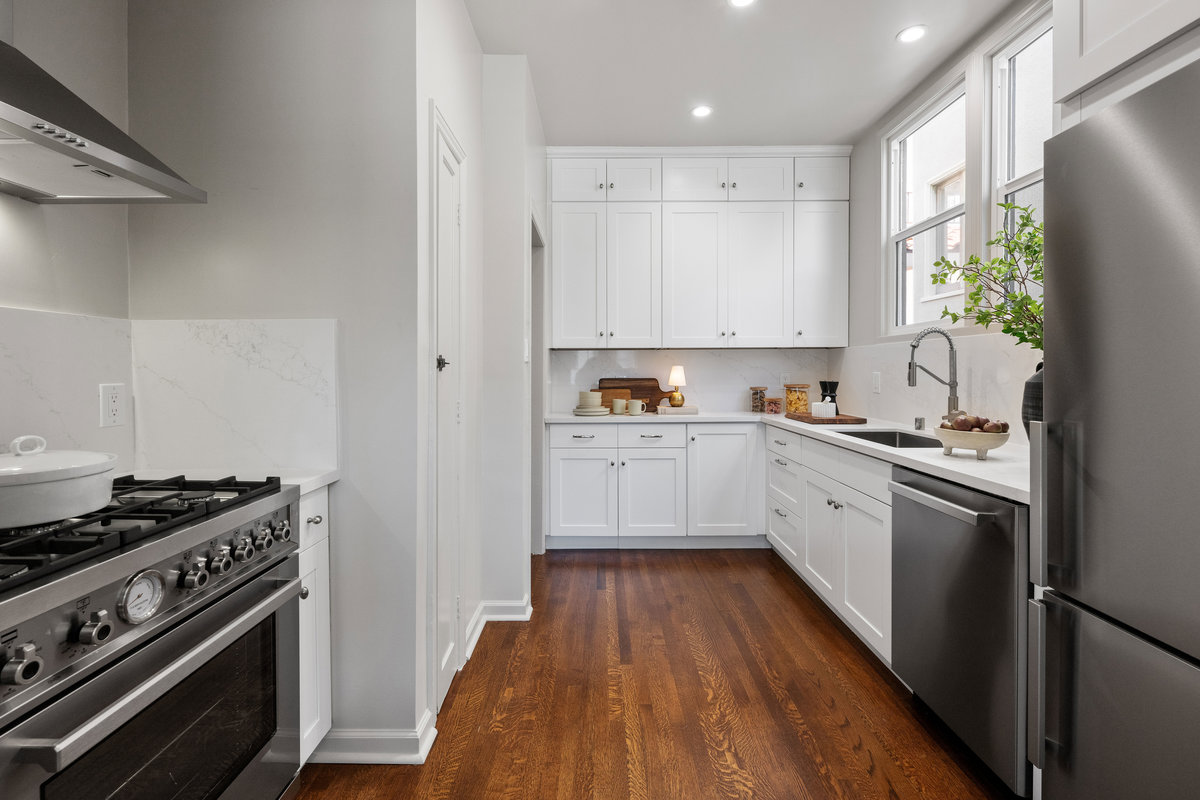 New kitchen with Bertrazzoni appliances, quartz counters, pantry cabinet