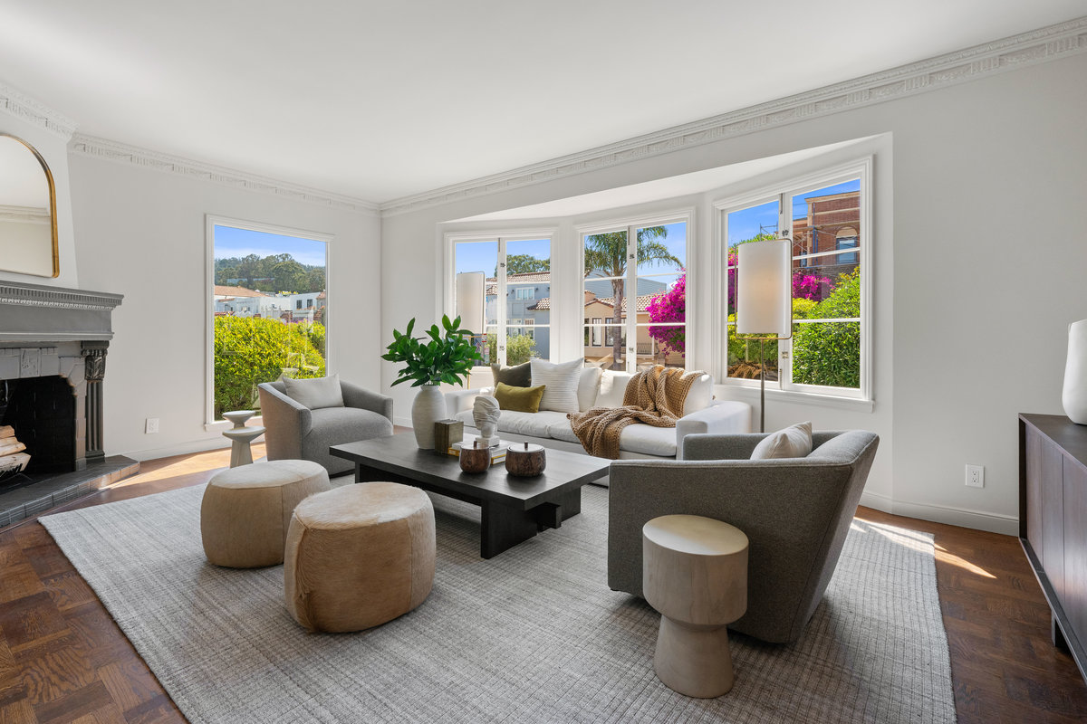 Living room with fireplace and south & west windows