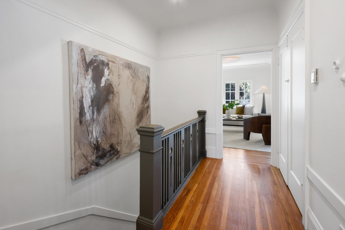 Stairs up from 2832 Lyon's front door; hardwood floors throughout; large closet on right