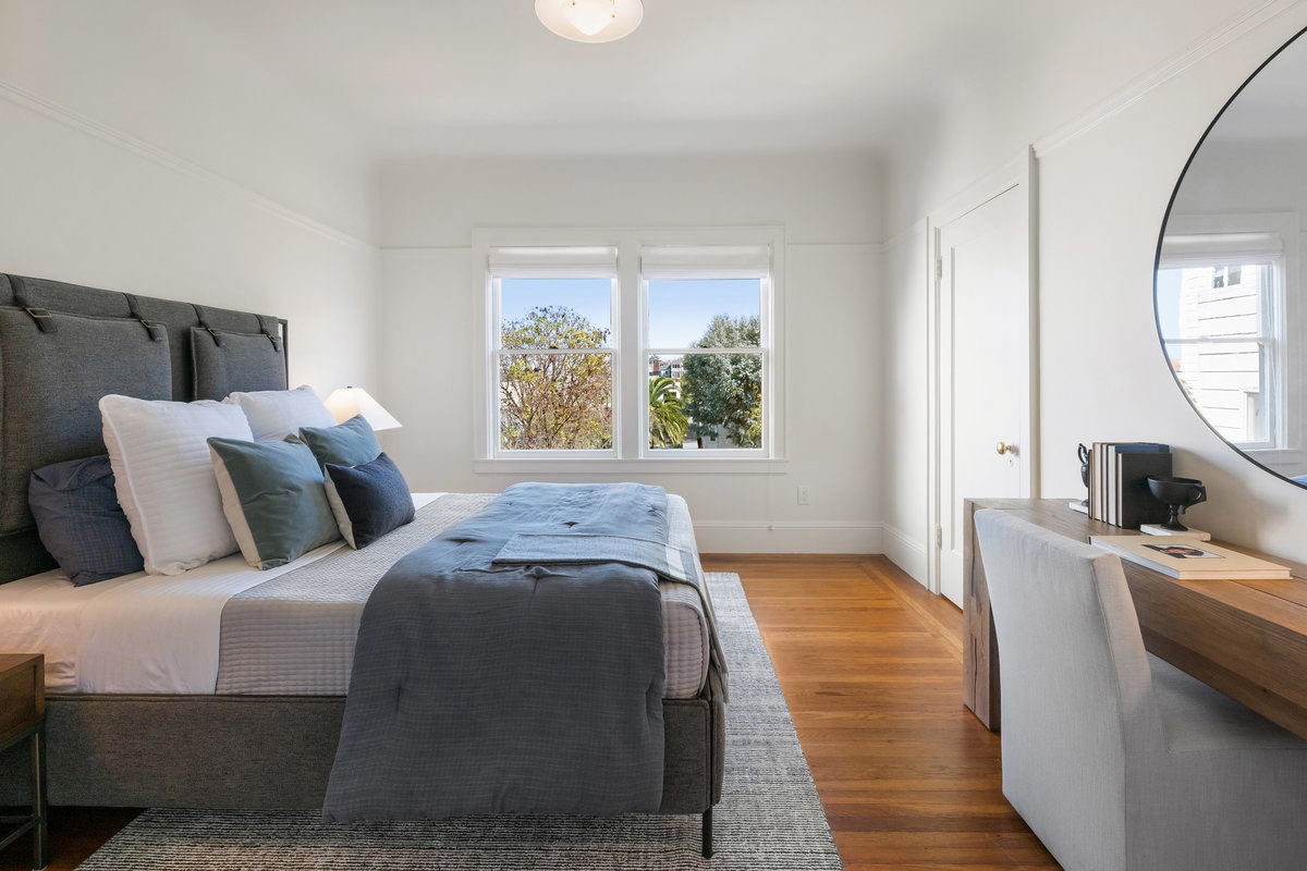 Bedroom two with east windows, closet ; doorway on right opens to primary bedroom