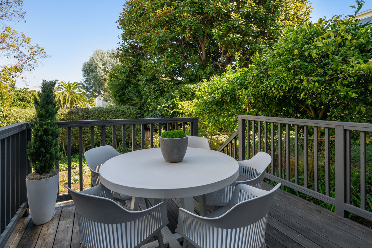 Private deck, accessed via flex room, leads to shared garden