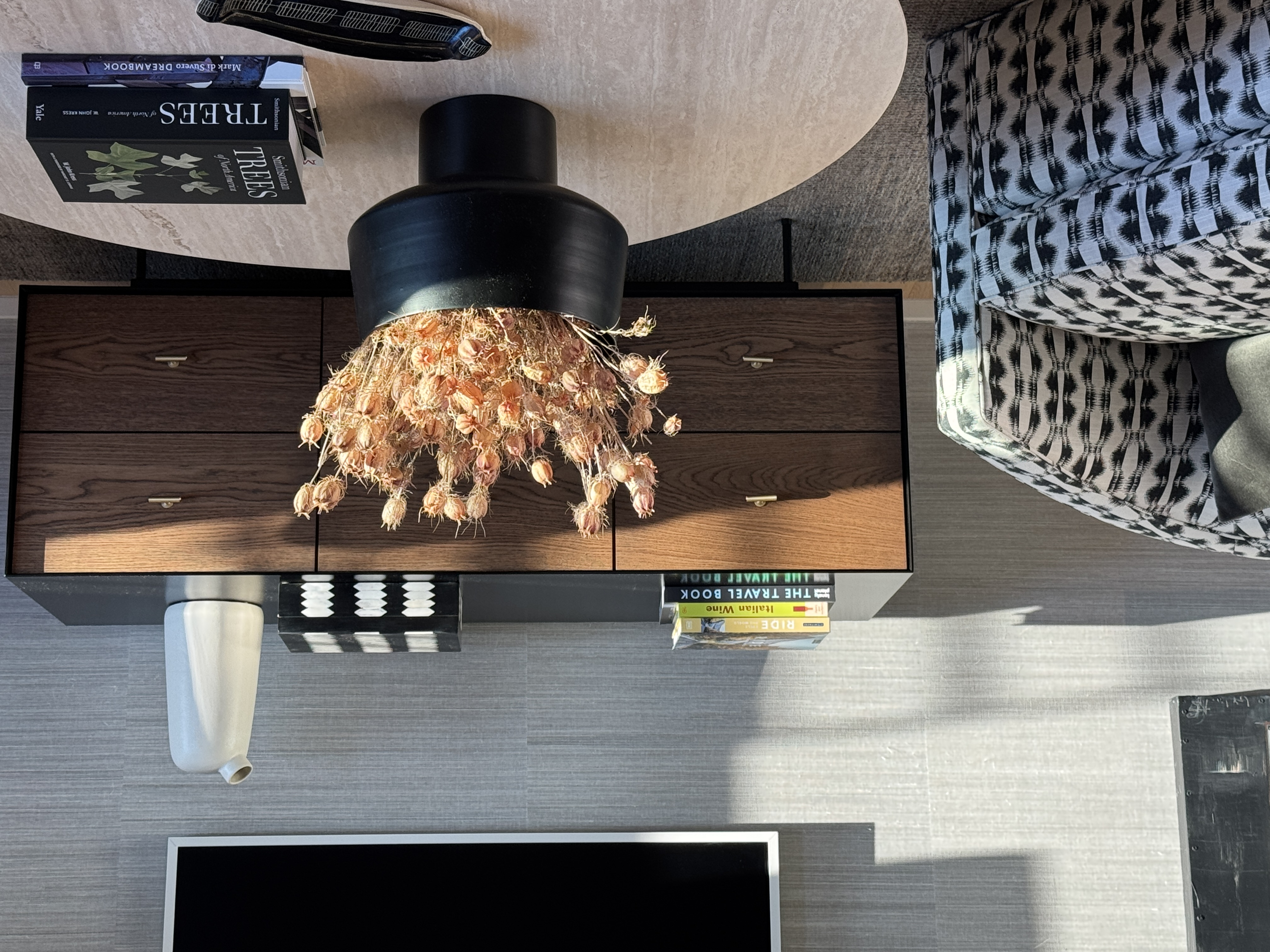 Design details: Phillip Jeffries wall covering, travertine coffee table, Croft House dresser, swivel chair, Samsung flat screen TV