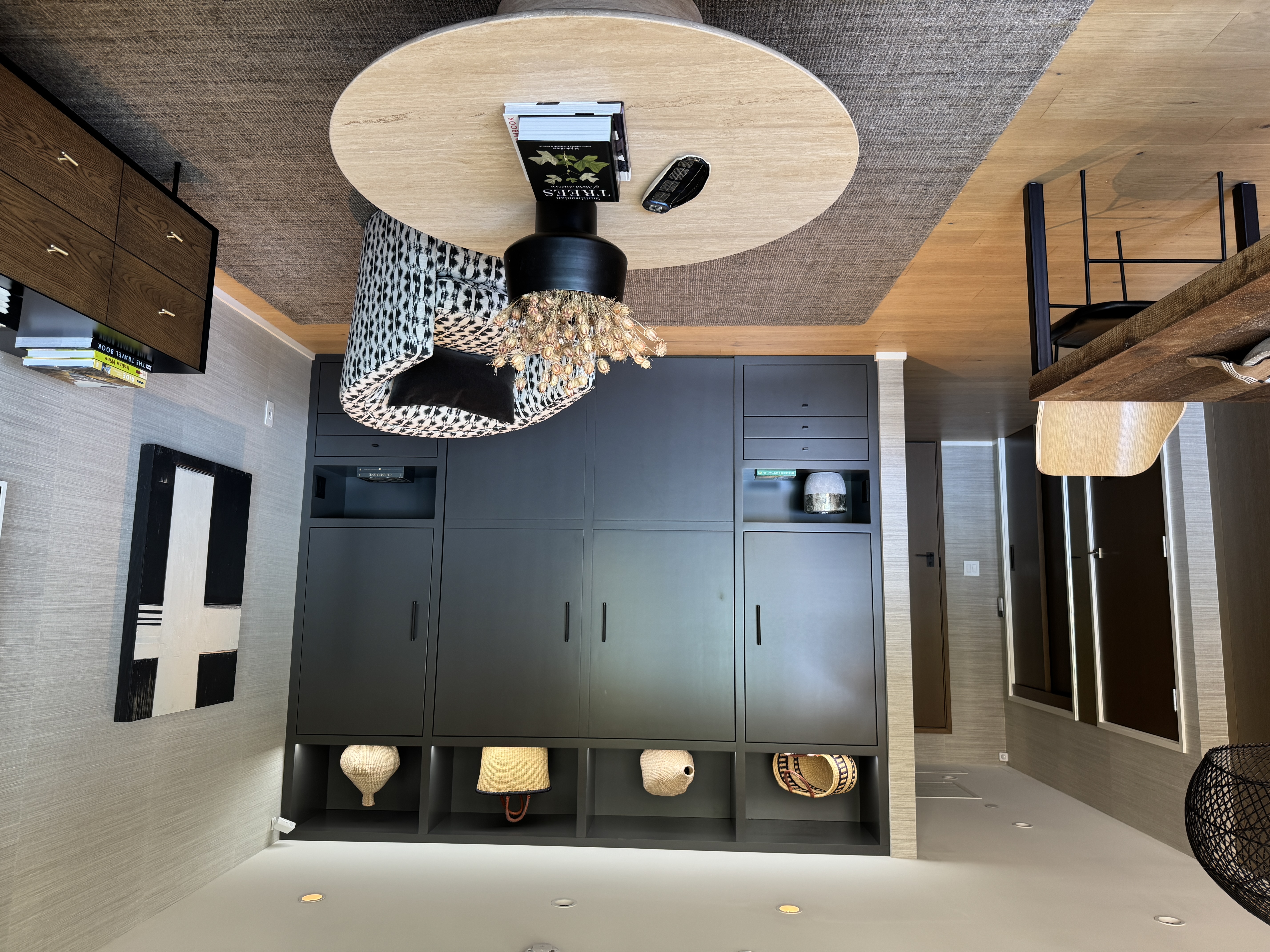 Custom cabinetry holds bed, closets, drawers, display areas