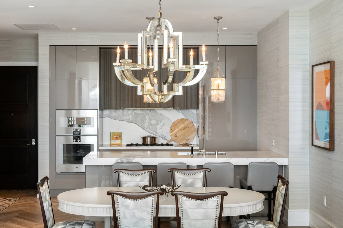 Gorgeous light fixtures, statuario marble counters and backsplash