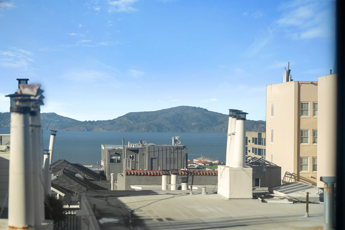 Zoomed view of the Bay across rooftops, taken from primary suite