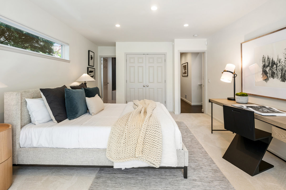 Third bedroom suite with ample closets; entrance to its bath in the left background