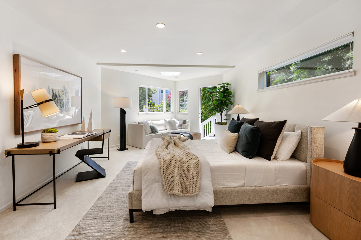 Lower level's third bedroom suite, a few steps down from the main level, offers garden access and multiple uses