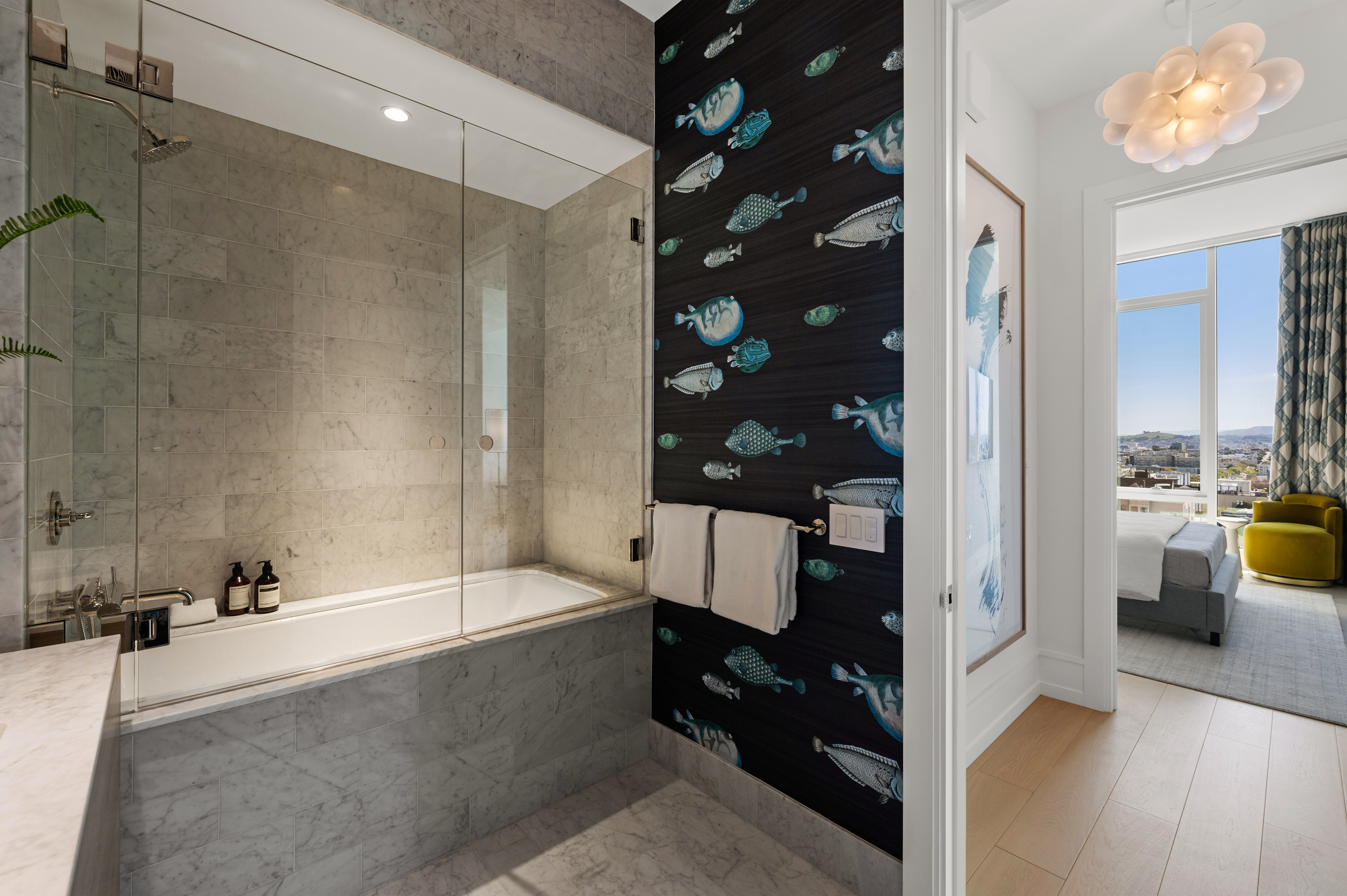 Guest bath with shower over tub; across from guest bedroom and southern windows