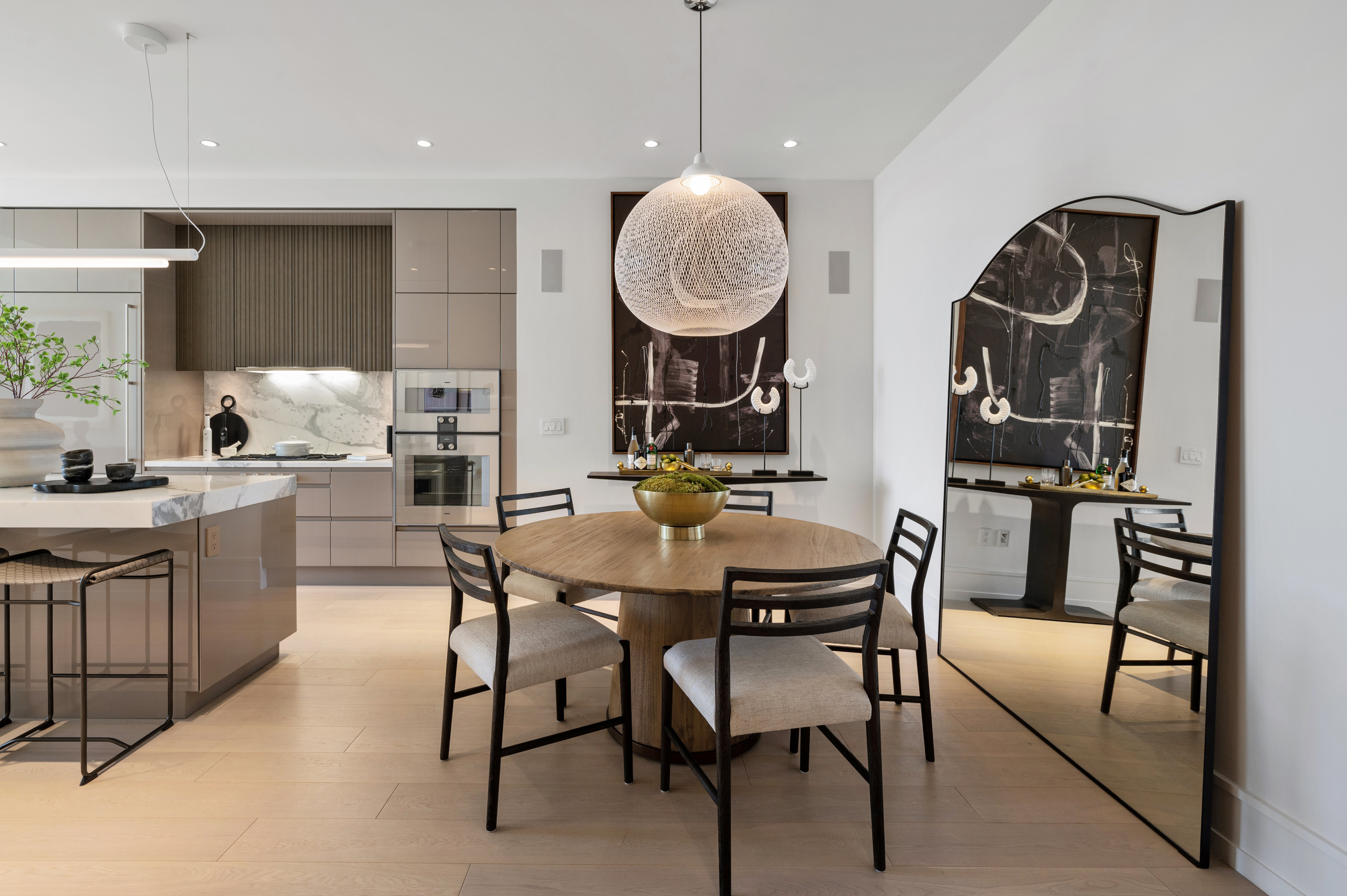 Dining area of great room; note the wide plank pale European oak floors. NOTE: This light fixture no longer exists.