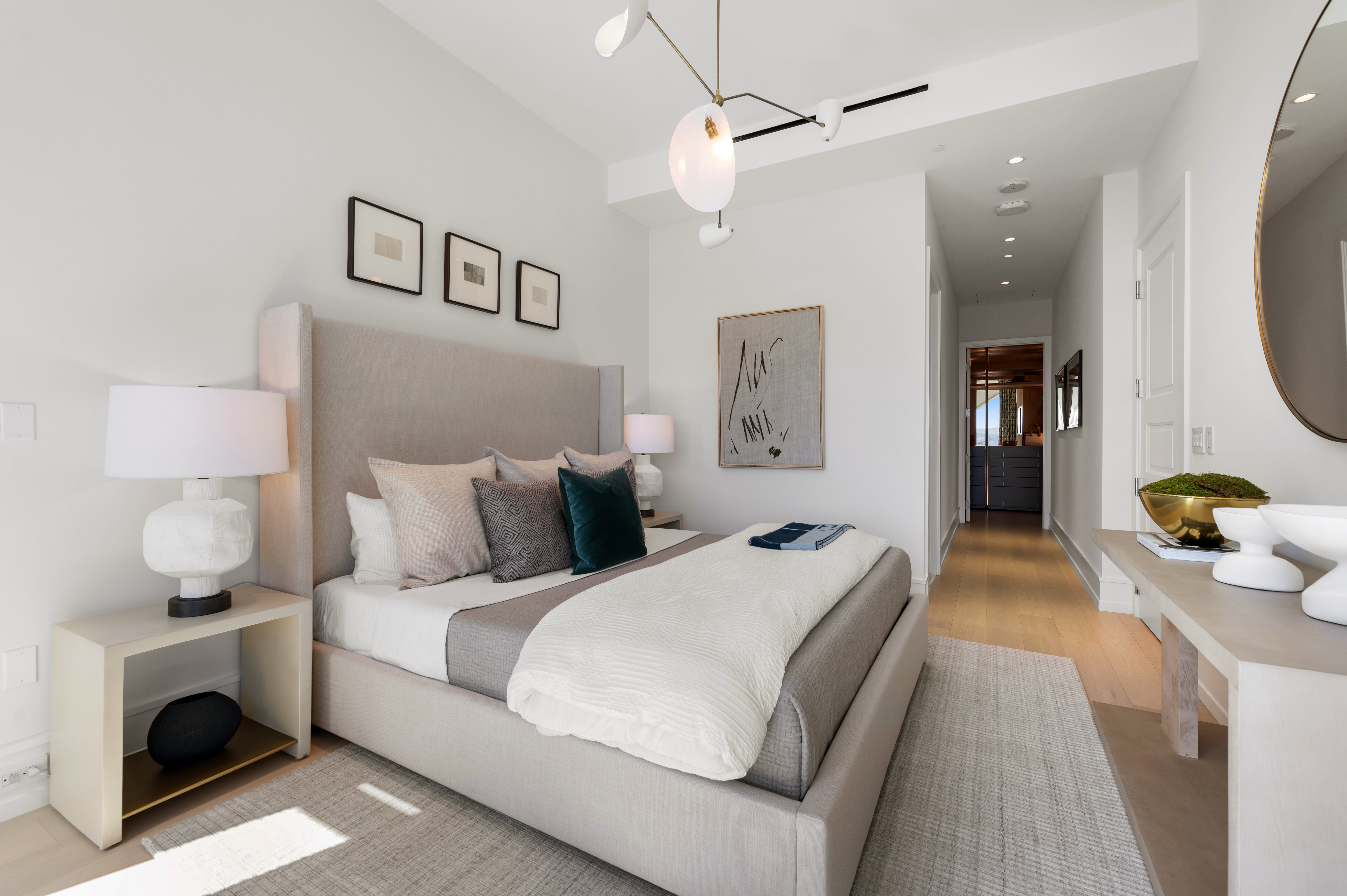 Primary suite with doorway to primary bath on left and beautifully outfitted dressing room at the end